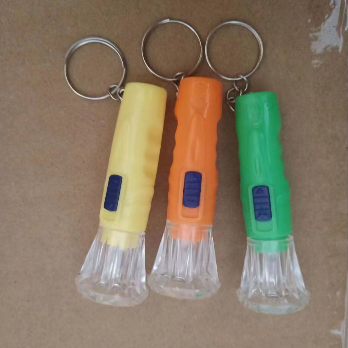 Household Small Flashlight Transparent Head Mini Small Flashlight Street Stall Hot Selling Plastic Button Battery Flashlight Keychain