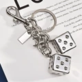 Dice string three-dimensional keychain gilt silver