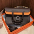 Ebony color with orange-tc leather