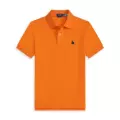 Orange polo green label