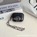 Black oval small disc round earphone case + crow bracelet