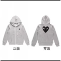 Gray pullover with a large black heart on the back and a zipper