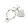 Creative New Silver-plated Love Bow Pendant Fashion All-match UV Bead Hanging Luggage Keychain Beaded Accessories