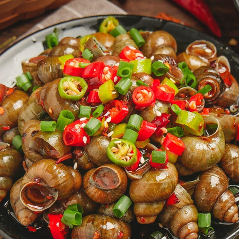 Spicy and Delicious Cooked and Frozen Snails as a Snack to Accompany Drinks