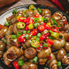 Spicy and Delicious Cooked and Frozen Snails as a Snack to Accompany Drinks