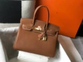 Golden brown with gold hardware