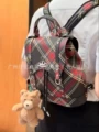 Black and red plaid shoulders