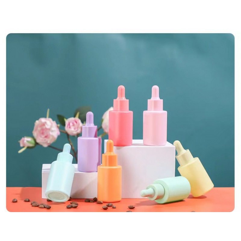 In stock macaron essential oil bottle 30ml color flat shoulder essence bottle cosmetics sub-packaging small sample bottle dropper small bottle
