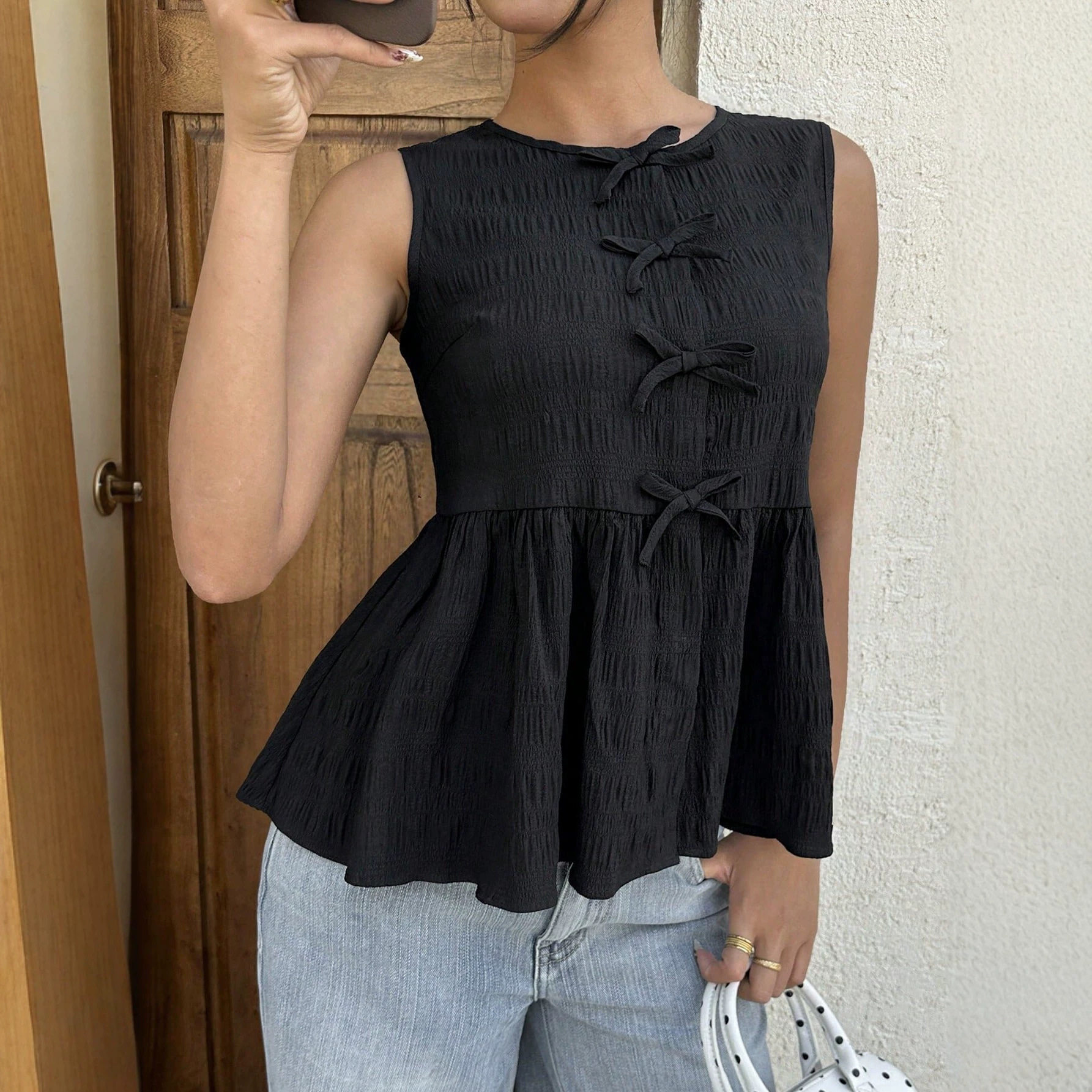 Sleeveless Bow Decorated Top Slim Fit Ruffled Hem Summer Style Perfect for Casual Outings Wholesale Available