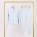 Powder blue gold zipper jacket and cropped pants suit