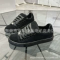 Black low-top suede