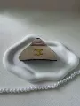 Brushed triangle gold cap