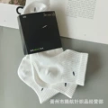 White towel bottom middle tube