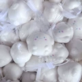 White dog [about 6cm] in mesh bag