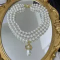 GOLD THREE LAYER SATURN PEARL NECKLACE