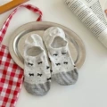 A pair of light gray