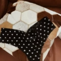 Black dot white love-thong