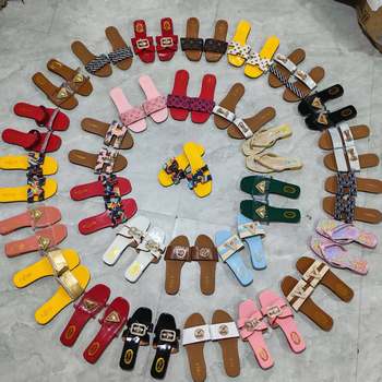 Large Stock of African-Style Flat Slippers with Various Styles, Including Buckle Details, Plain Design, and Sequin Embellishments