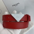 P-shaped silver buckle with red belt on white background