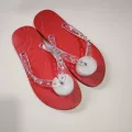 Red transparent flip flops
