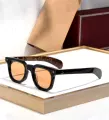 Black frame, wood grain legs, orange slice accent