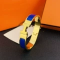 Size 17 wide version 12mm gold + dark blue bracelet with logo h