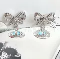 Blue orb bow earrings