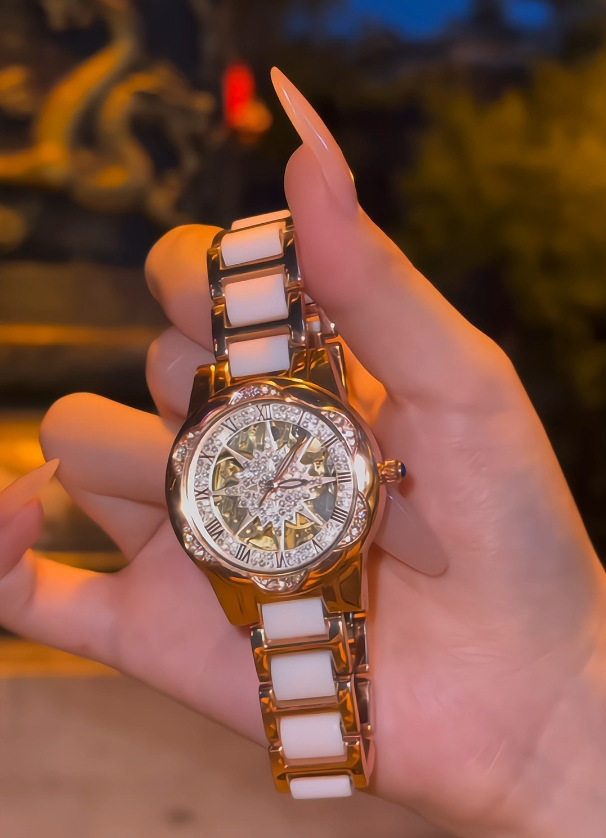 A generation of shaking audio and video number explosions sunflower hollow ladies watch ceramic white flywheel diamond watch women 2 undefined