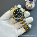 Two-tone gold and steel black bezel black dial