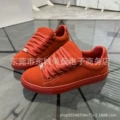 Red low-top suede