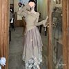 Trendy Two-Piece Set for Women: Autumn Design with a Slim-Fit Off-Shoulder Top and Irregular Skirt with an Atmospheric Feel