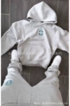 Gray hooded suit (badge)