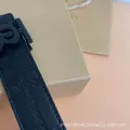 Embossed tb black buckle