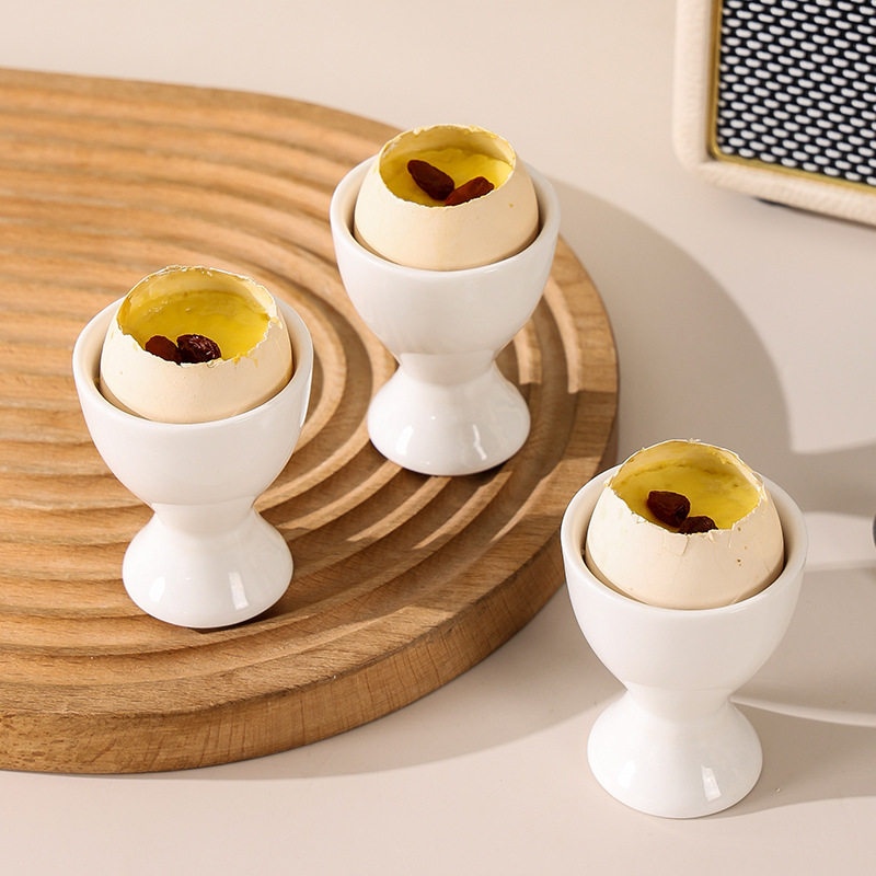 Simple ceramic egg cup egg cup egg cup egg cup high leg egg tray simple dining table Cup bracket creative candle Cup decoration
