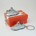 A pair of silver bullets with nk red and white hook box