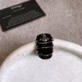 Black and silver armor ring