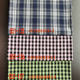 Spring and summer plaid shirt fabric 21 polyester cotton yarn-dyed fabric 135 square grams woven jacquard fabric spot