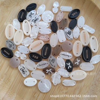 Shellfish-like resin clothing logo logo tag letters oval bow buckle fashion versatile clothing accessories decorative buttons