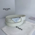 P-shaped silver buckle with white background and white belt
