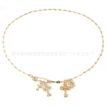 Gold pin flame cross necklace