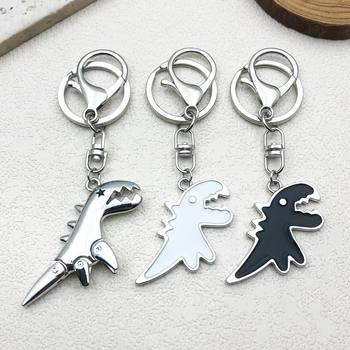 New cute black and white dinosaur couple pendant lobster clasp movable small dinosaur metal keychain Amazon