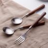 Imitation walnut wooden handle simple texture stainless steel spoon Fork suit household Western food spoon high-looking tableware