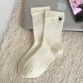 A pair of milky white