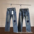 Mud-dyed patchwork jeans