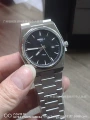 Old watch with silver and black glossy surface