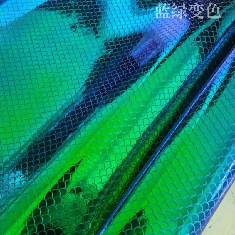 in stock manufacturers environmentally friendly fan-shaped magic color fish scale pattern embossed pu leather luggage notebook packaging hat fabric