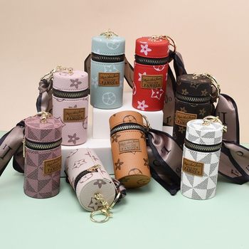 European and American presbyter coin purse 2023 new compact bag pendant earphone bag mouth red envelope mini keychain bag