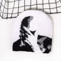 White hat stroking head