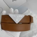 P-shaped silver buckle with white background and yellow belt