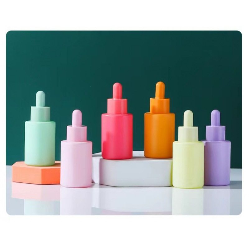 In stock macaron essential oil bottle 30ml color flat shoulder essence bottle cosmetics sub-packaging small sample bottle dropper small bottle